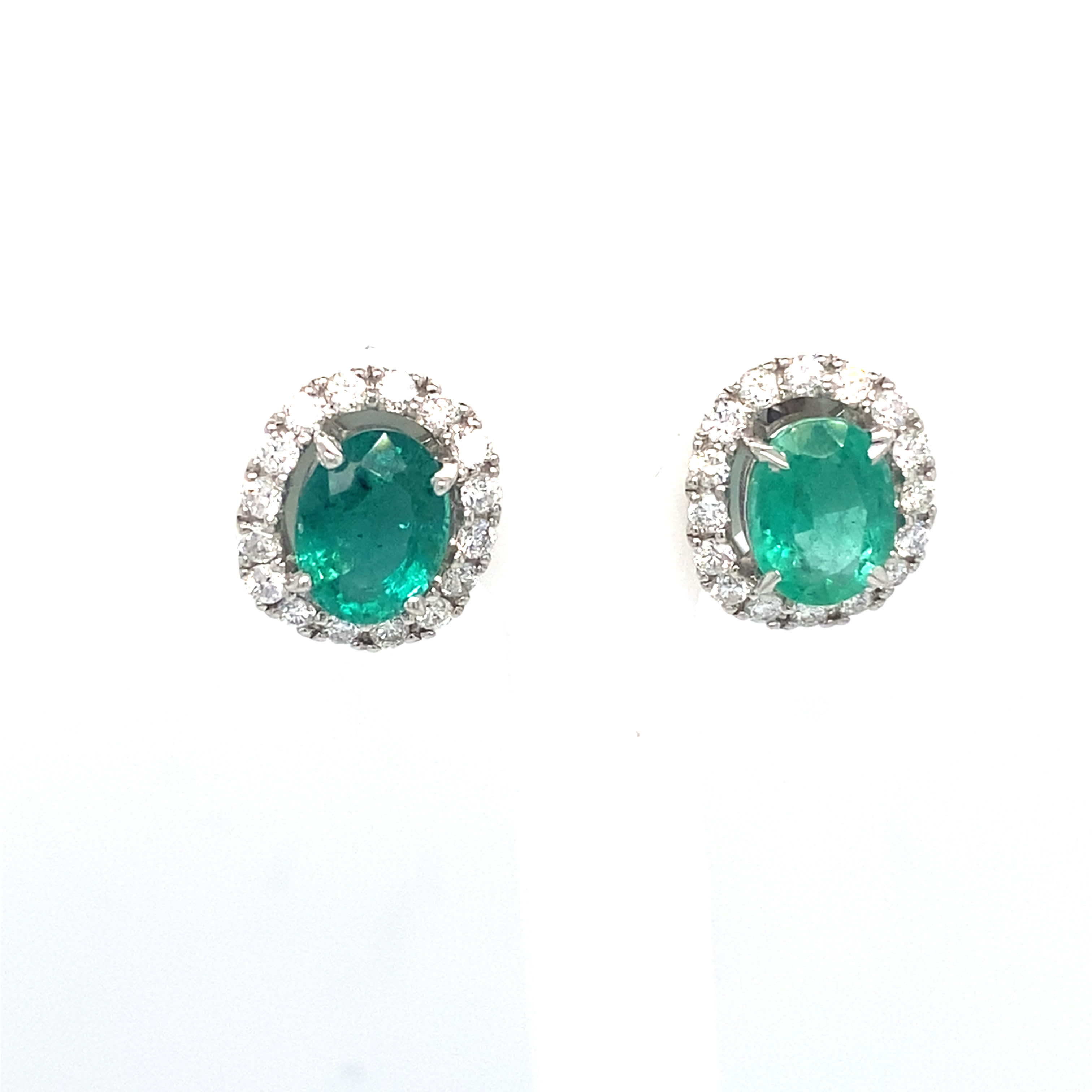 Emerald studs w Diamond Halos